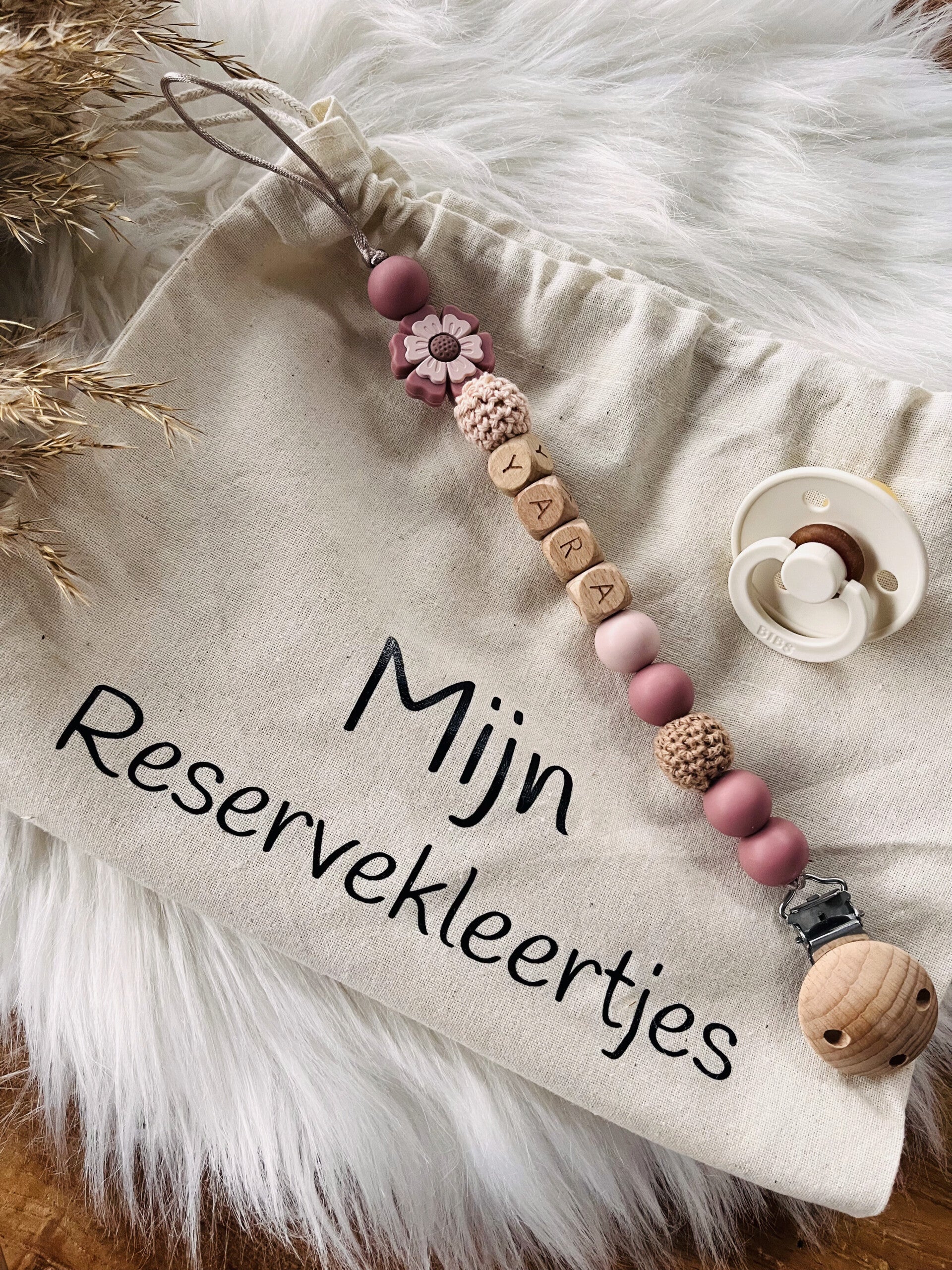 speenkoord roze bloem