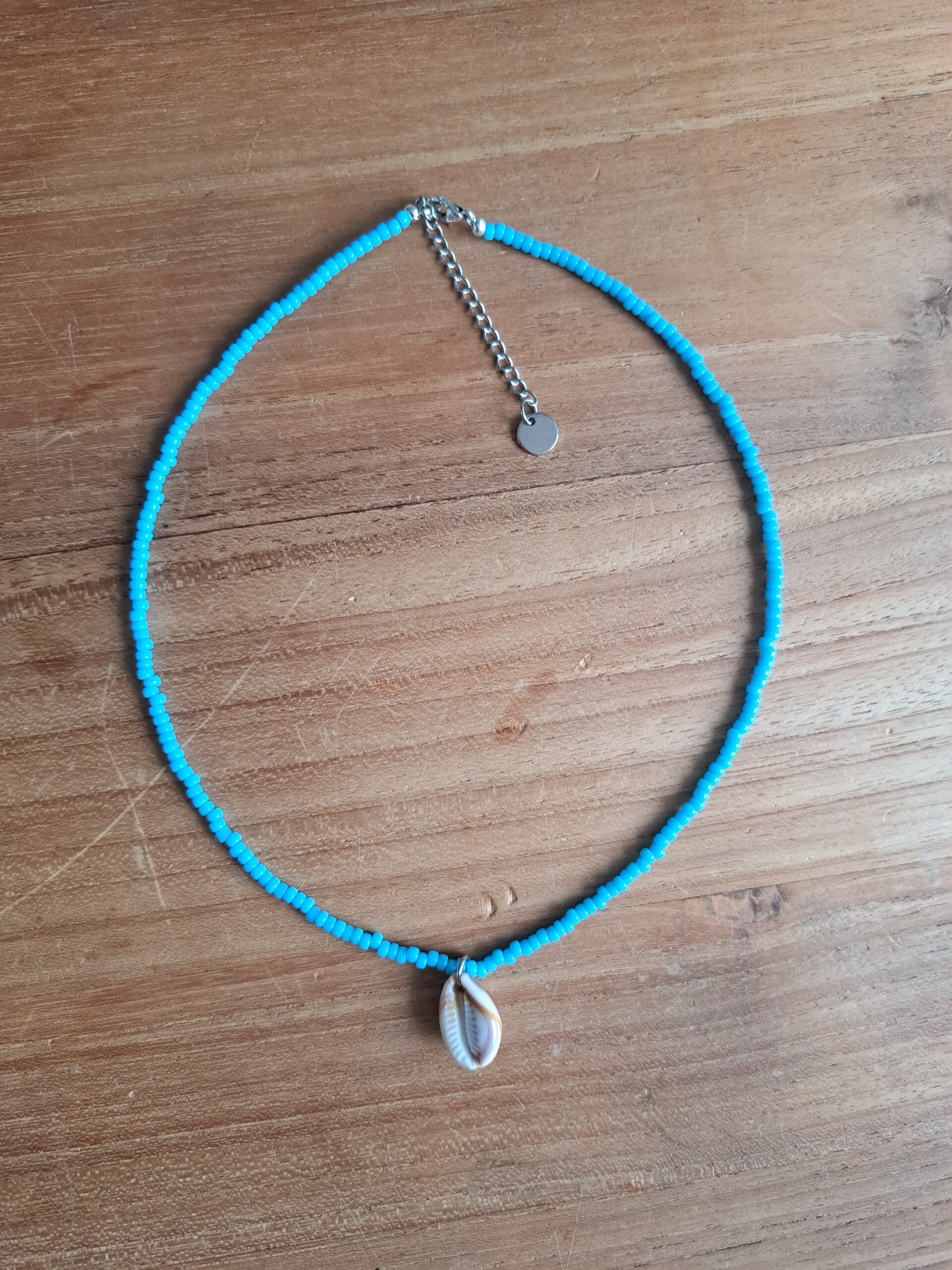 Surf ketting met schelp blauw