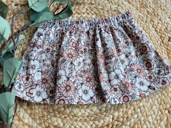 Rimpelrokje 74/80 beige bloemenprint