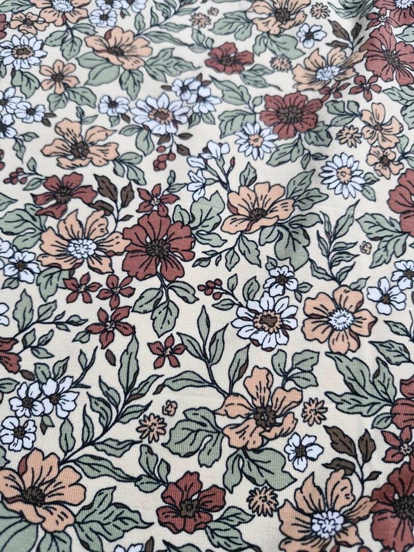 Coupon katoen tricot 1mx1.4m boterbloem geel bloemenprint