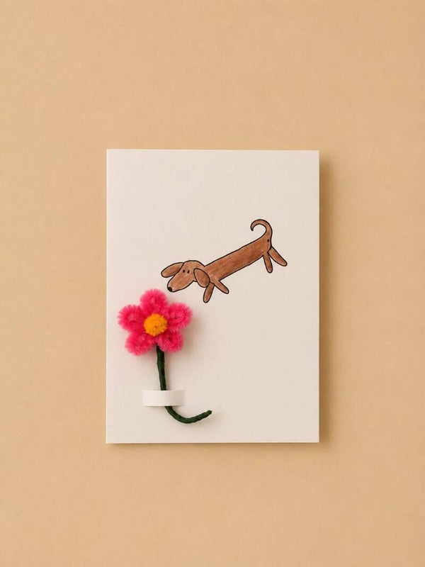 Kaartje teckel met roze bloem