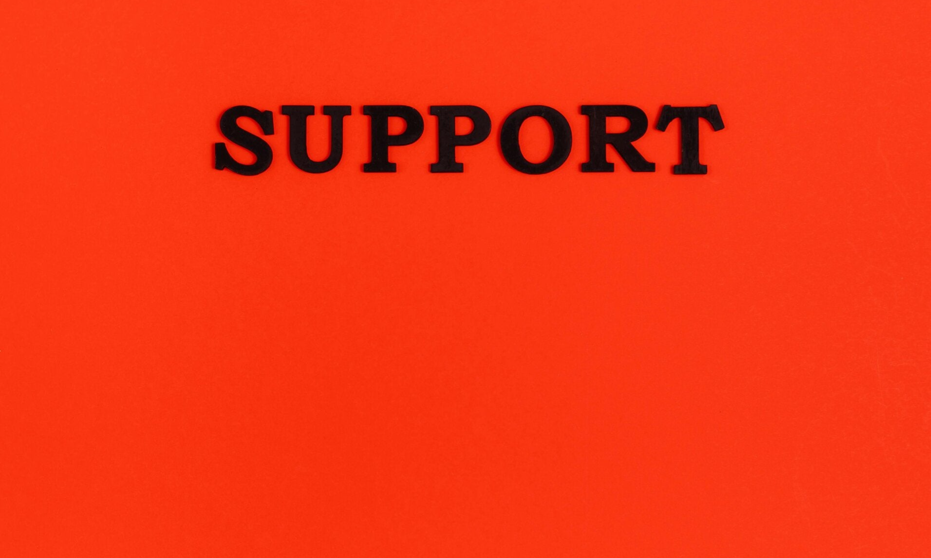 Black lettered Support on Red background