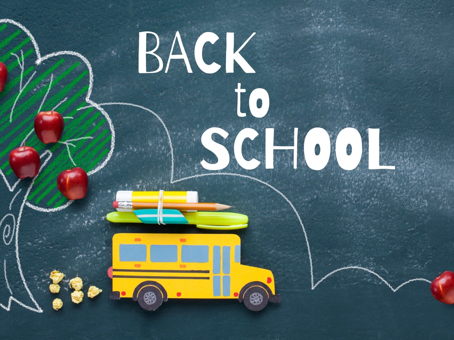 Back to school bus apples and blackboard