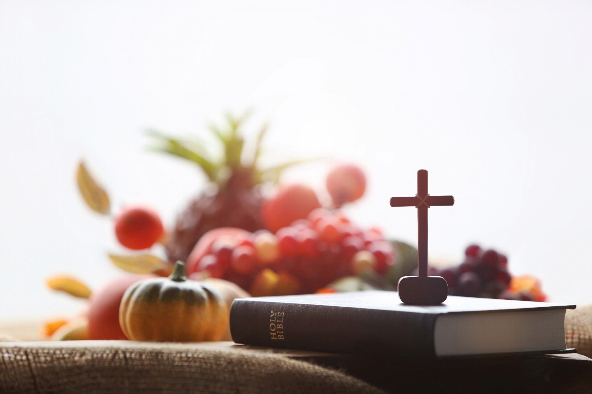 Thanksgiving fall table with bible and cross