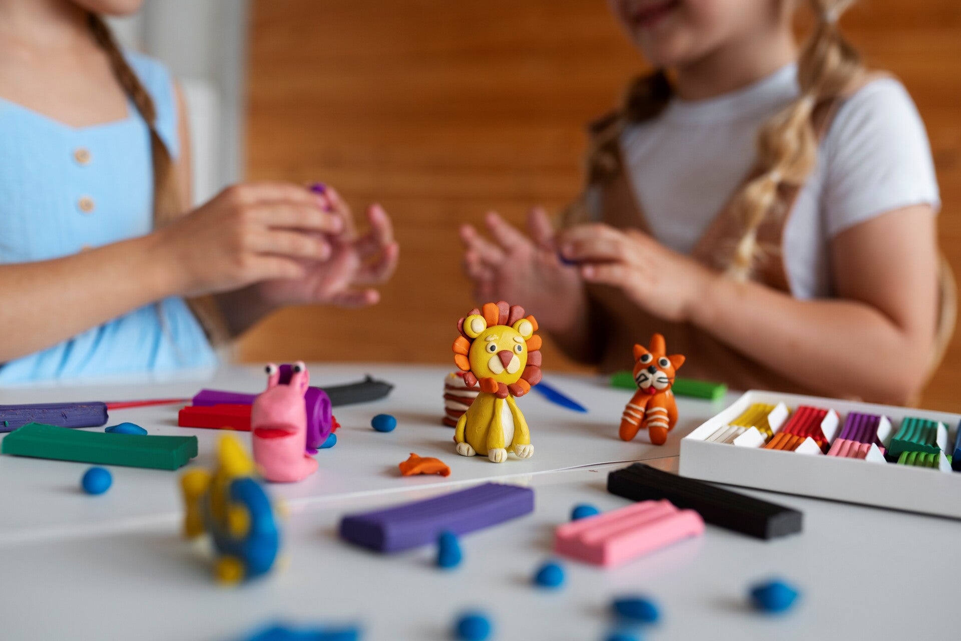 kids playing with dough making animals