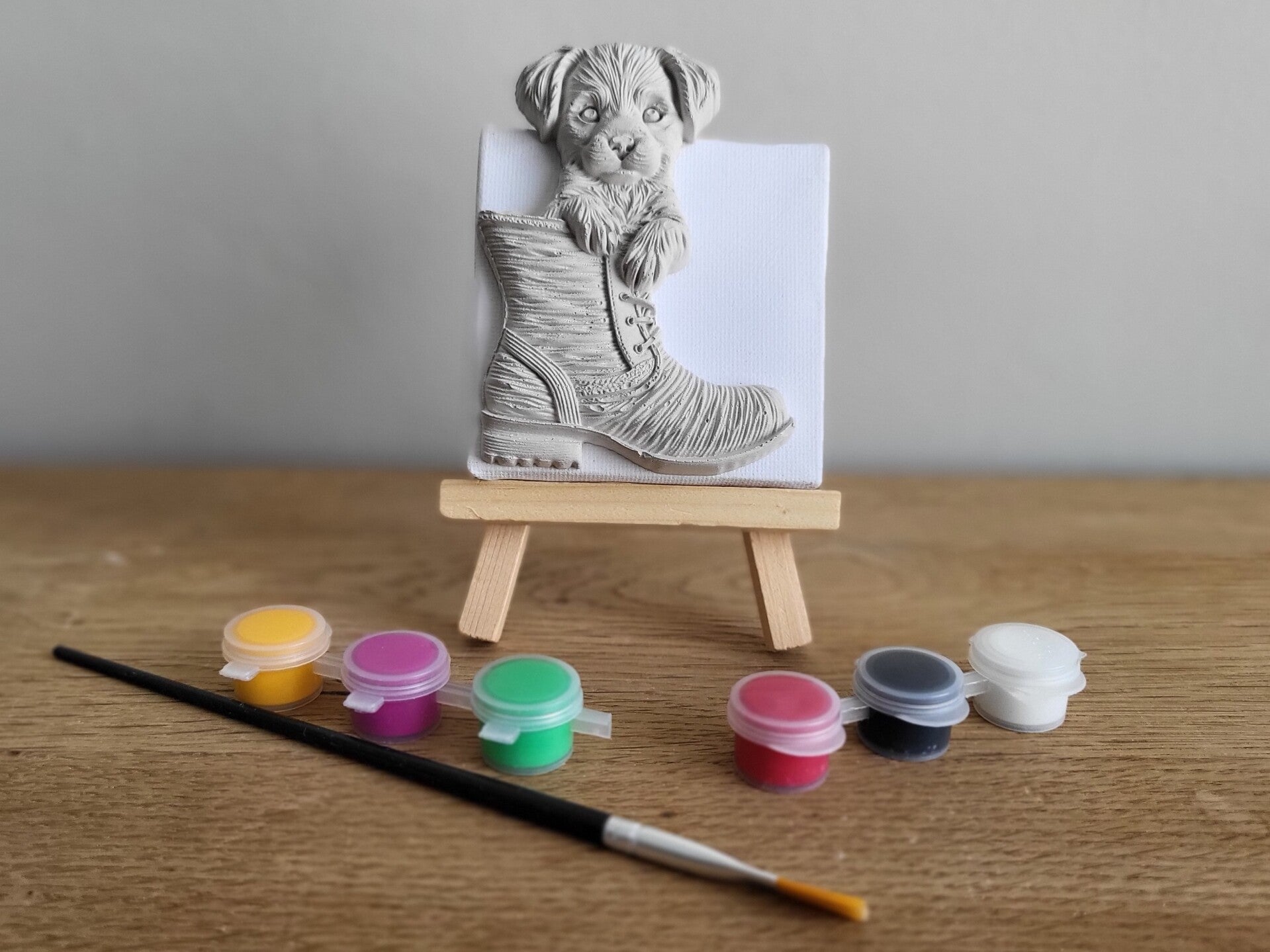Schilder je eigen canvas: Hond in laars