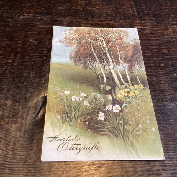 Antieke paaskaart voorjaarsbloemen in landschap