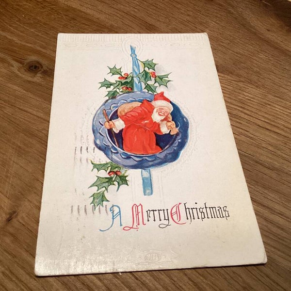 Antieke kerstkaart in reliëf uit 1915, kerstman