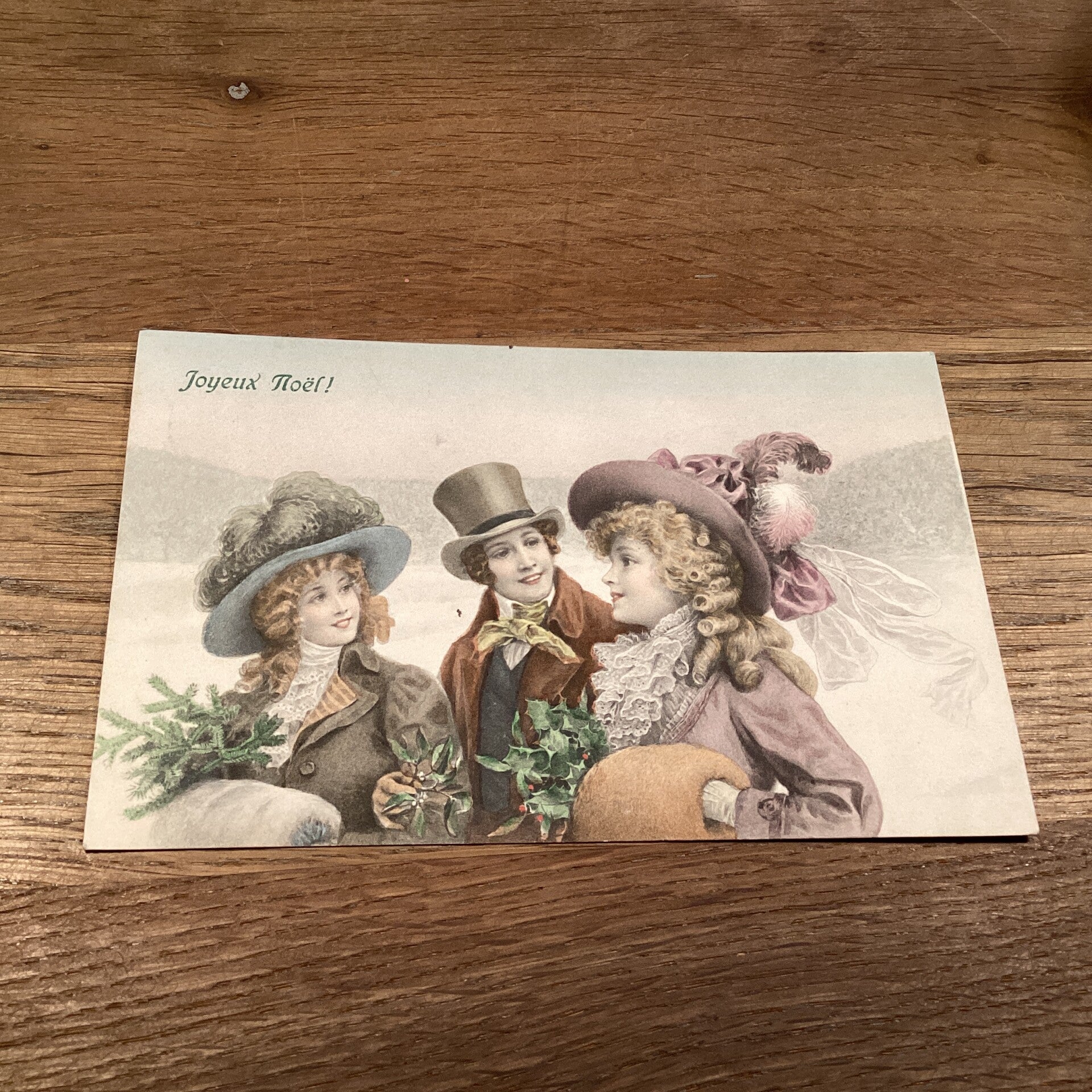 Antieke kerstkaart dames en heer, 1910