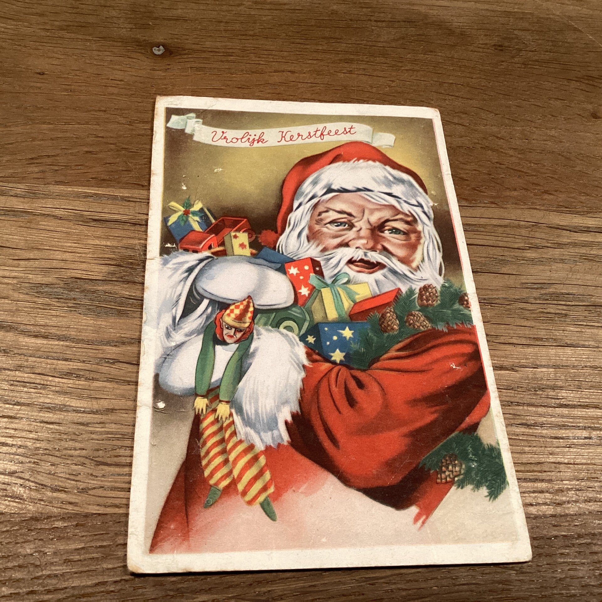 Antieke kerstkaart, kerstman met cadeau’s, 1952