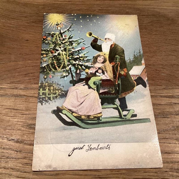 Antieke kerstkaart met kerstman op slee, dame en kerstboom, 1906