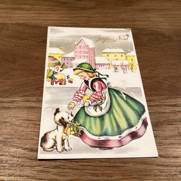 Antieke kerstkaart, meisje met hondje