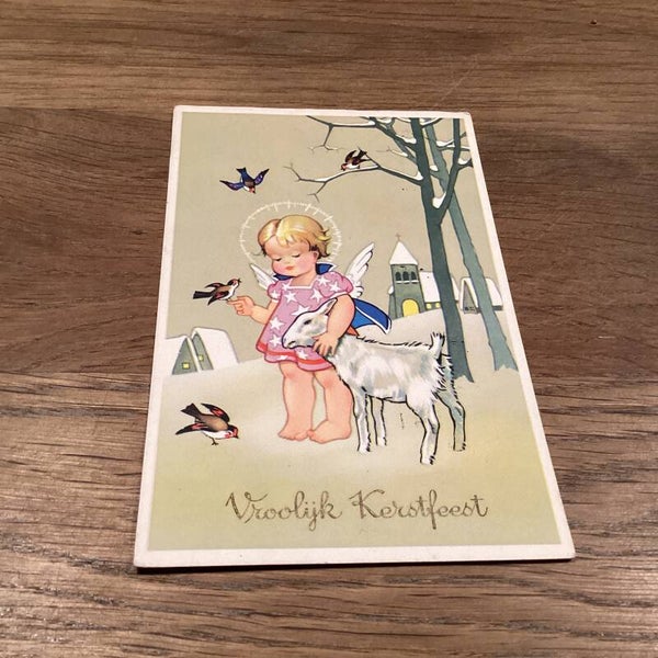 Antieke kerstkaart, engeltje met geitje