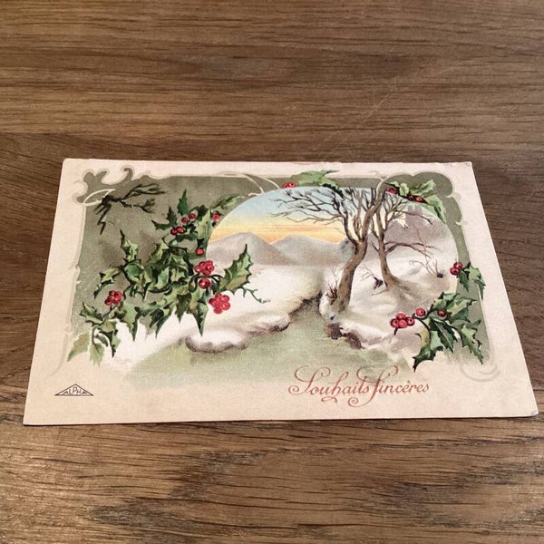 Antieke kerstkaart uit 1918, besneeuwd landschap met hulst