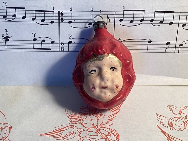 Oude kerstbal engelachtig meisjesgezichtje 6x4,5x5 cm