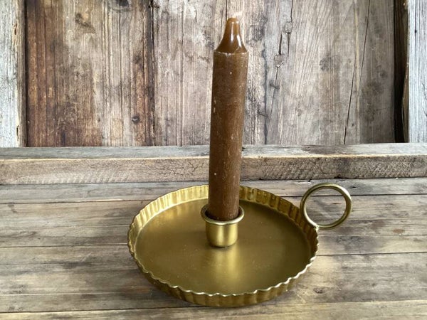 Goudkleurige blaker met kaars