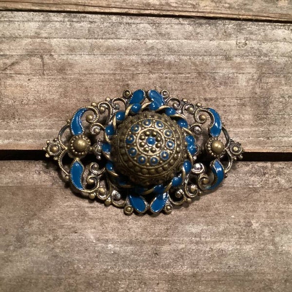 Mooie oude broche koper met blauw emaille 5x3 cm