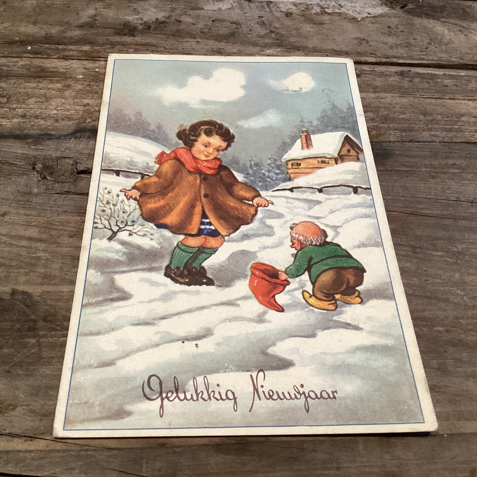 Oude nieuwjaarskaart met kabouter
