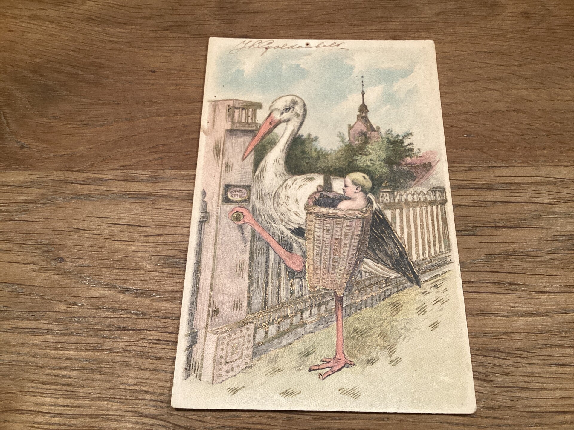 Antieke ansichtkaart met ooievaar, begin 1900, goudaccenten, in reliëf