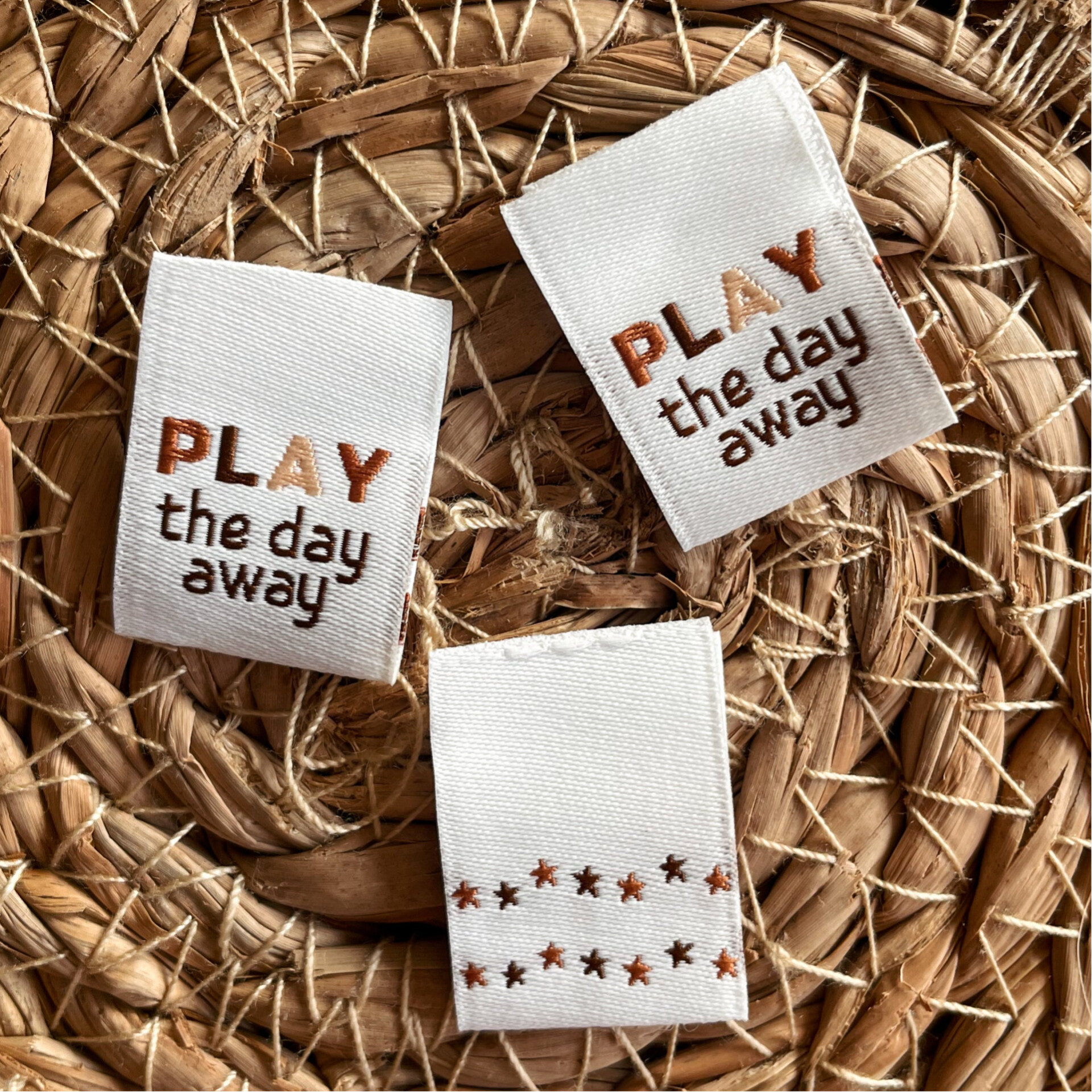 Folded label ‘Play the day away'