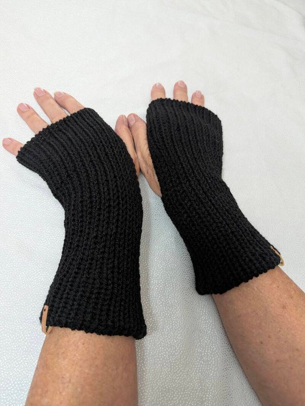 Black pair of knitted hand warmers
