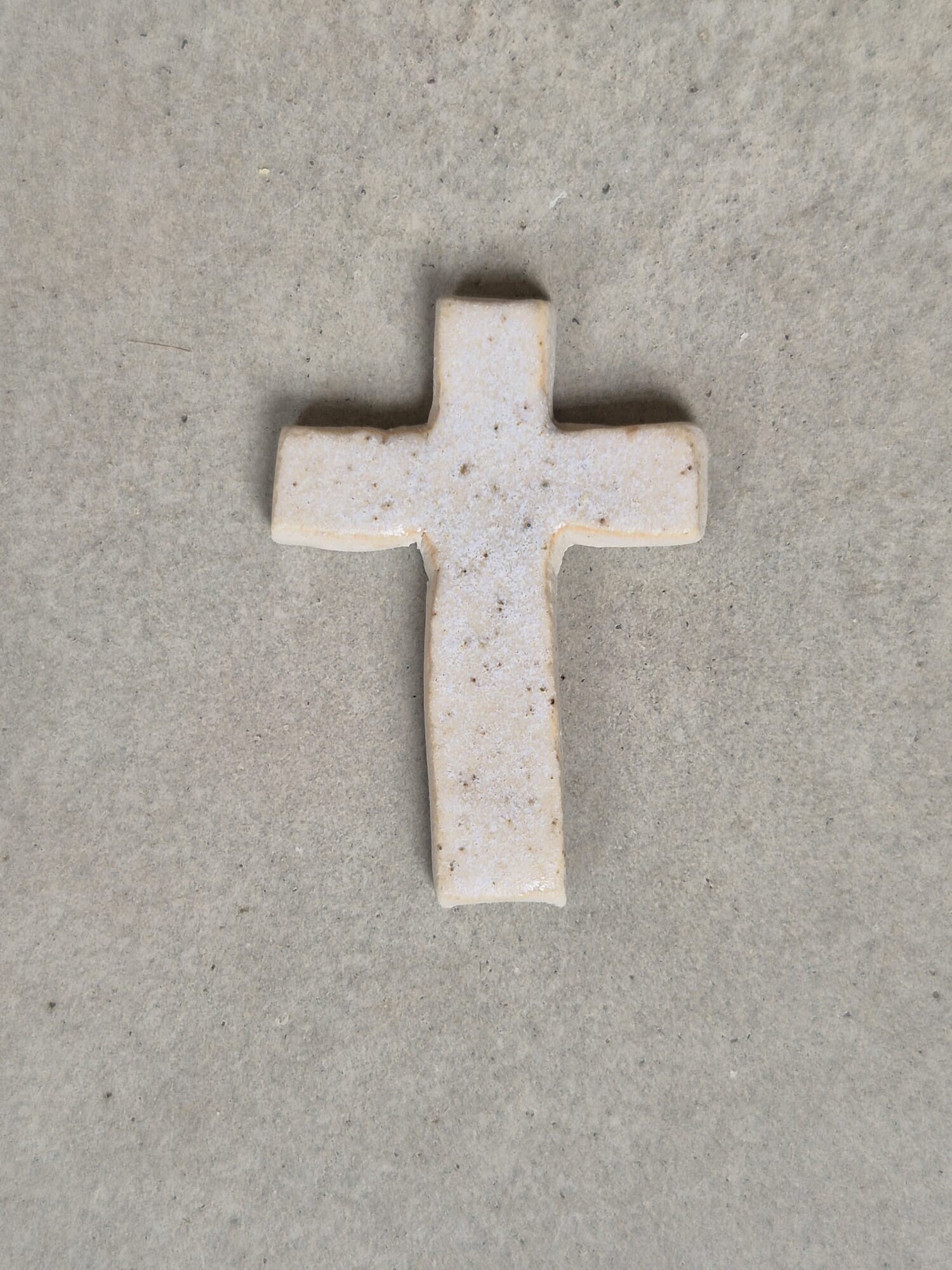 Kruisje Beige