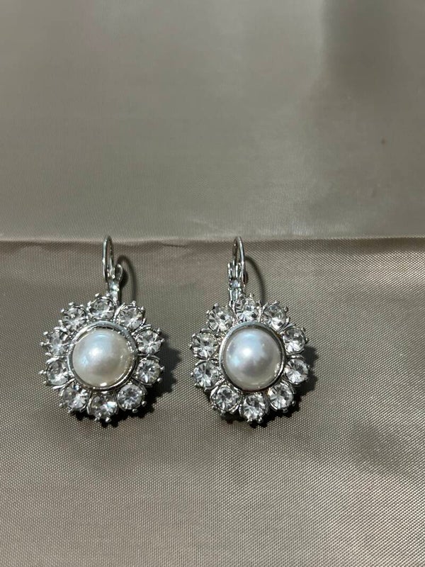 Silver earrings.