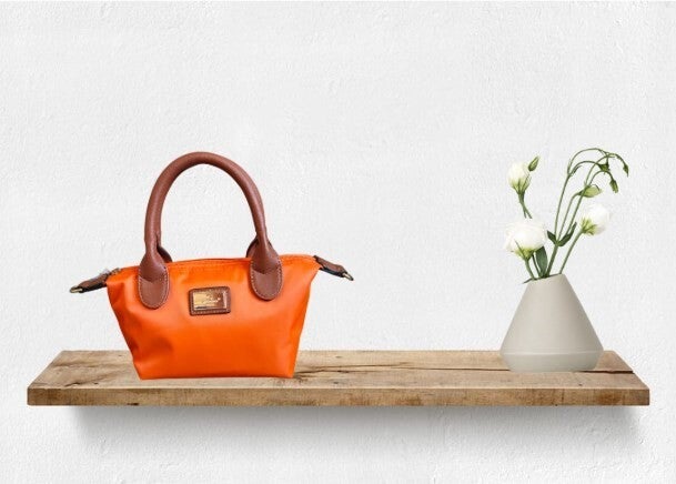 "La Balade mini" oranje damestas