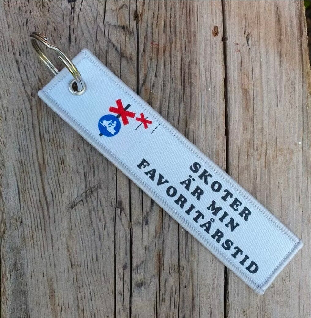 Tag/nyckelring Skoter är min favoritårstid