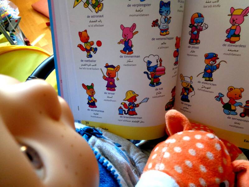 Tim reading an Arabic book