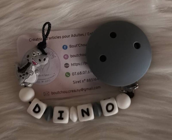 Attache tétine en silicone motif Dino