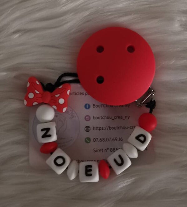 Attache tétine en silicone motif Nœud à pois