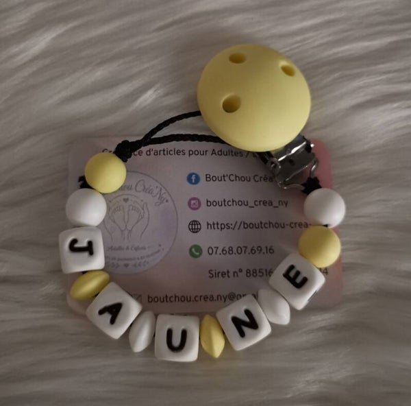 Attache tétine en silicone sans motif jaune