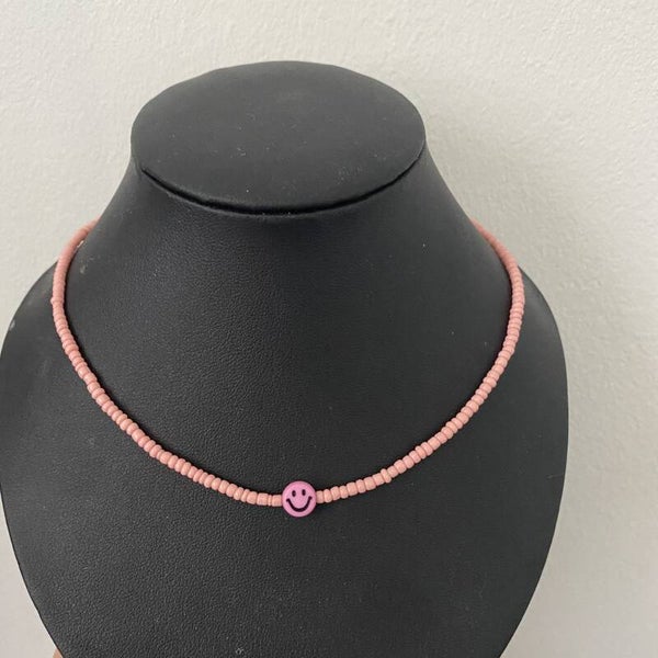 Smiley ketting roze