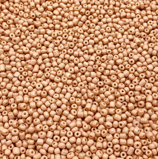 Kralen oranje huidskleur achtig 10 gram.