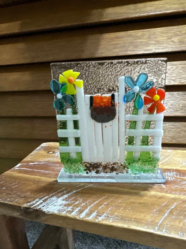 Flowers with white fence