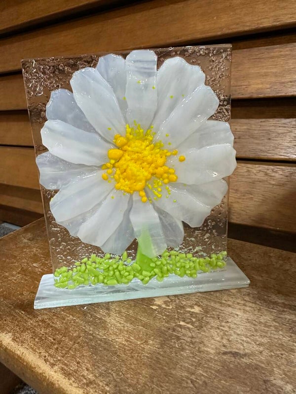 White flower panels on glass stands