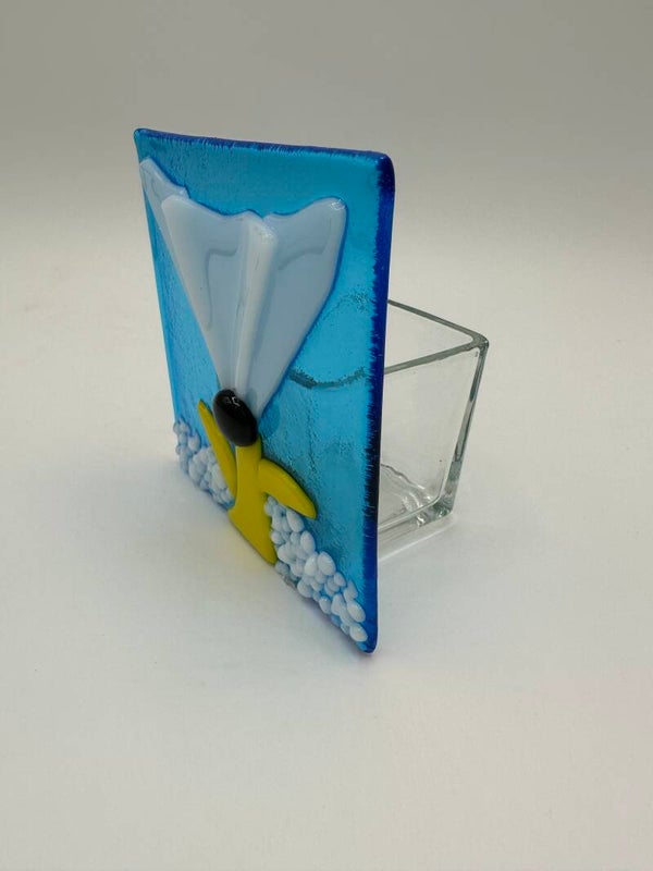 White flower with aqua background tea light