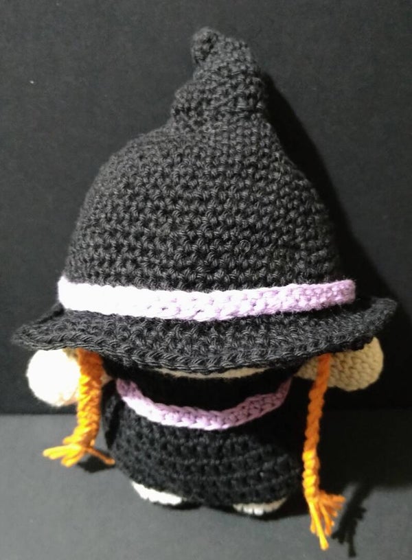 Doll in witch outfit