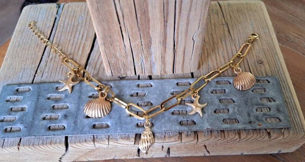 Armband schakel schelpen goud