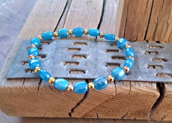 Armband blauw goud. Elastisch.