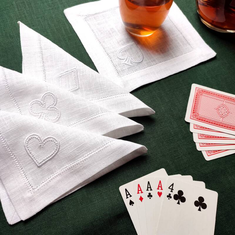 Hemstitched poker cocktail napkins with embrkoidered card symbols: clubs, hearts, diamonds and spades