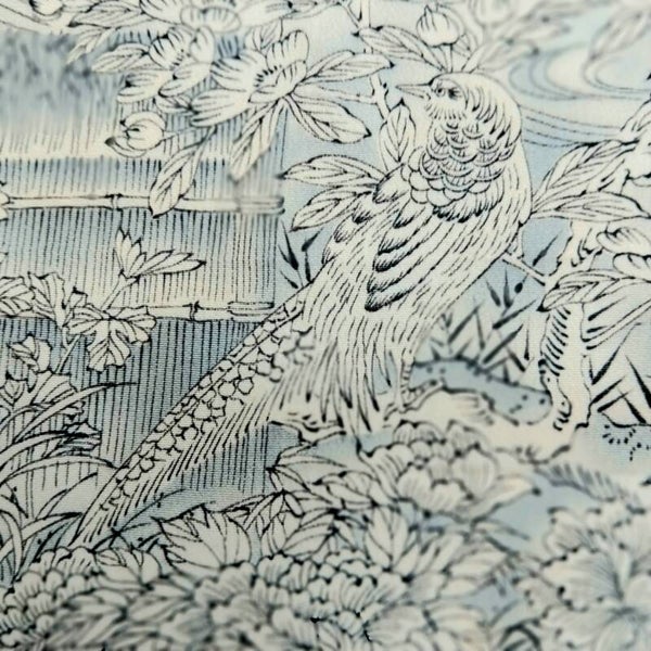 Creme lichtblauw 'Vogel in landschap' 55x36cm