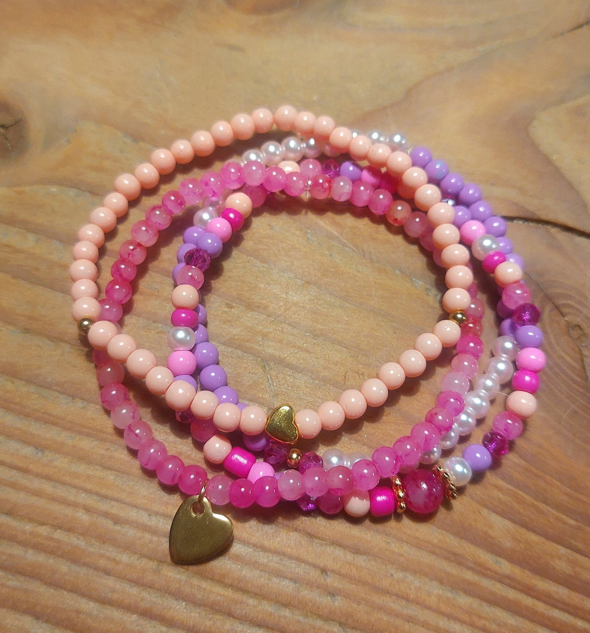 Armband 4 delig roze, zalm en lila