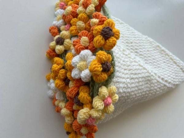 Crocheted blanket with puffy flowers