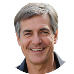 Photo of a white man in his 50s, graying hair, styled neatly, blue collar shirt.