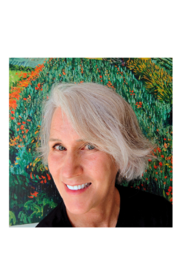 Photo of Maya Frost, founder of Collapse Forward, wearing a v-neck purple t-shirt and smiling in front of a dark wall painted with outlined flowers in white and blue.
