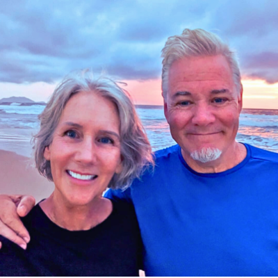 Photo of Maya Frost, founder of Collapse Forward, with her husband Tom on their 40th wedding anniversary in Brazil in 2025.