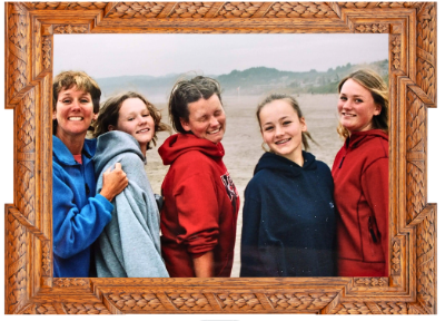 Maya Frost, left, founder of Collapse Forward and creator of Collapse Companioning, with her four daughters on the Oregon Coast in 2001.
