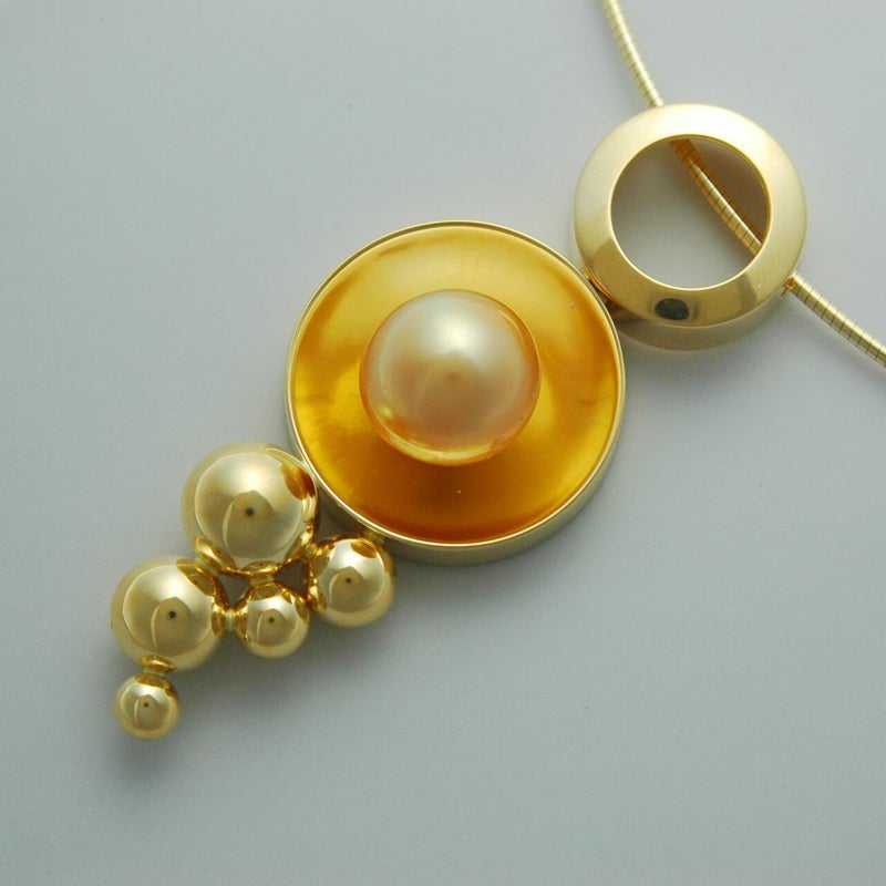 geel goud 18 kt - oranje parel